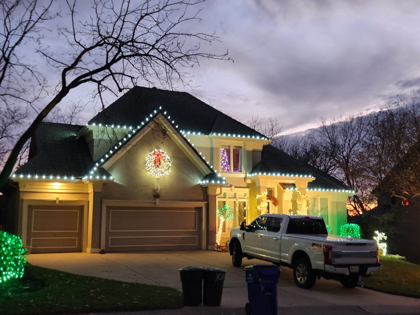 Large property lit along multiple rooflines at night — Redmond, WA