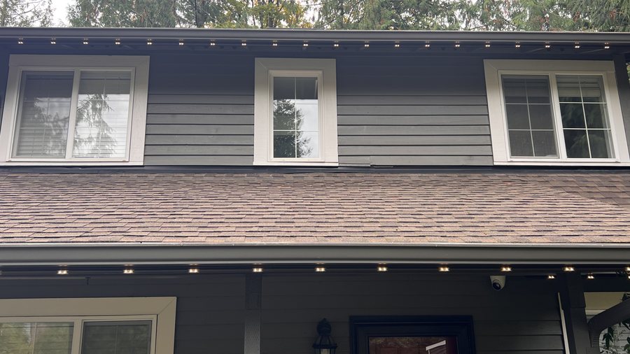 Eastside home with permanent roofline lighting shown in several color settings